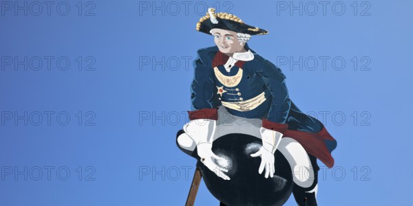 The ride on Münchhausen's cannonball, depicted in the Münchhausen town of Bodenwerder,