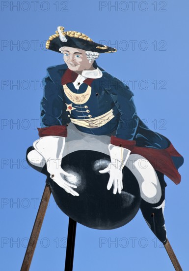 The ride on Münchhausen's cannonball, depicted in the Münchhausen town of Bodenwerder,