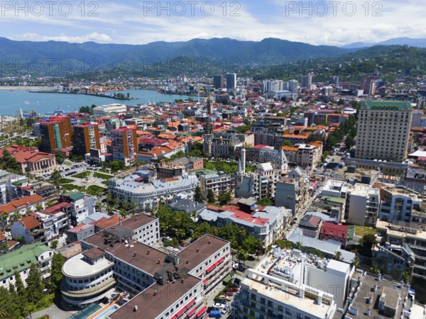 Urban environment with densely built-up areas and mountain backdrop, aerial view, Batumi, Black