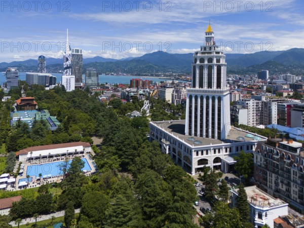 Cityscape with skyscrapers, park and sea near mountains, aerial view, on the right Hotel Sheraton,