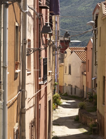 Sardinia, Narrow alley with picturesque house and window with streetlights, Bosa, Europe, Province