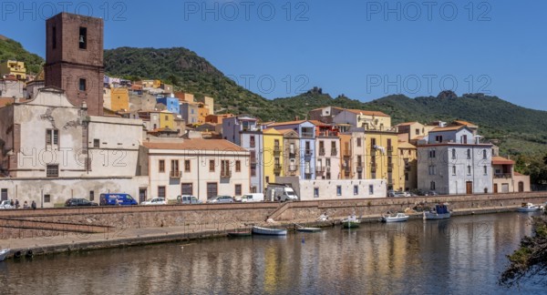 Sardinia, Town view, Residential houses on the river Temo and church tower, Bosa, Europe, Province