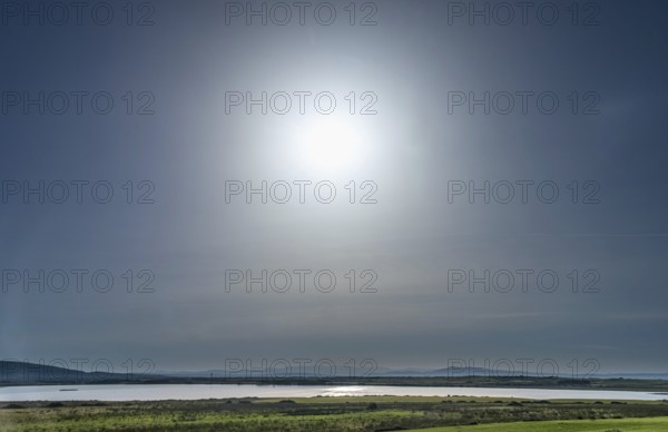 Sardinia, backlight sun over a lake and blue sky, Tharros, Europe, Province of Oristano, Italy,