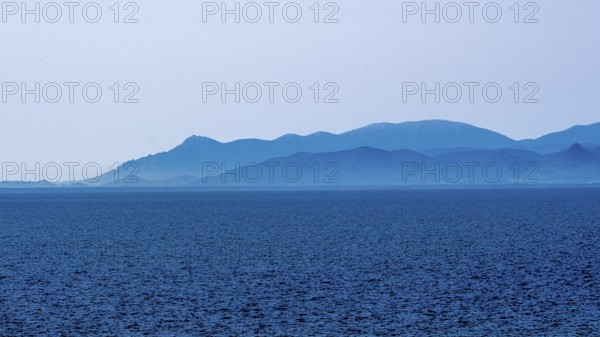 Sardinia, sea and mountains dipped in blue colour, Tharros, Europe, Province of Oristano, Italy,