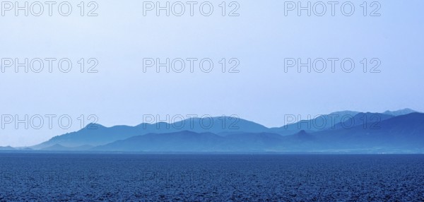 Sardinia, sea and mountains dipped in blue colour, Tharros, Europe, Province of Oristano, Italy,