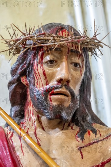 Sardinia, maltreated and bleeding face of Jesus with crown of thorns, Bosa, Europe, Province of
