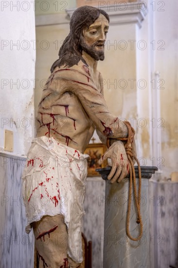 Sardinia, maltreated and bleeding Jesus figure, Bosa, Europe, Province of Oristano, Italy, nude