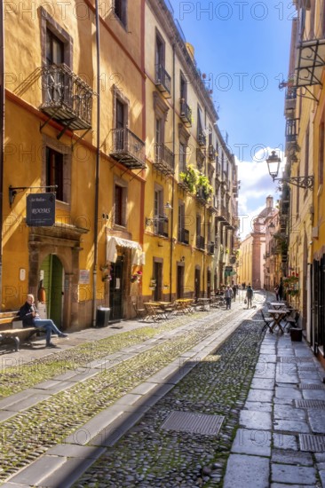 Sardinia, tourists in a pedestrian zone with picturesque house fronts, Bosa, Europe, Province of