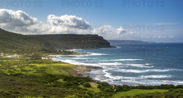 Sardinia, mountainous coastal landscape by the sea, blue sky with clouds, Bosa, Europe, Province of