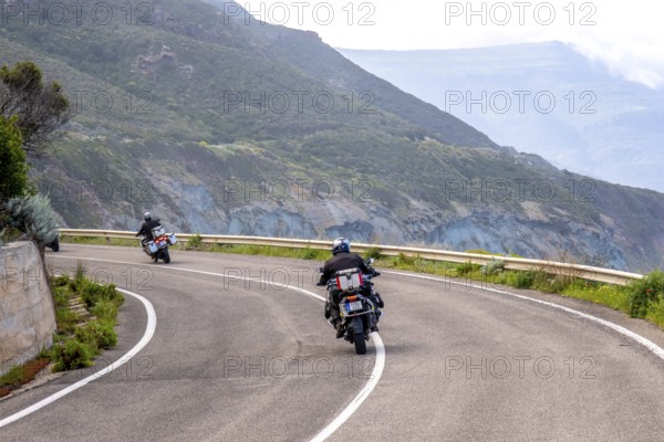 Sardinia, biker motorcyclist on the mountainous coastal road, Villanova Monteleone, Europe,