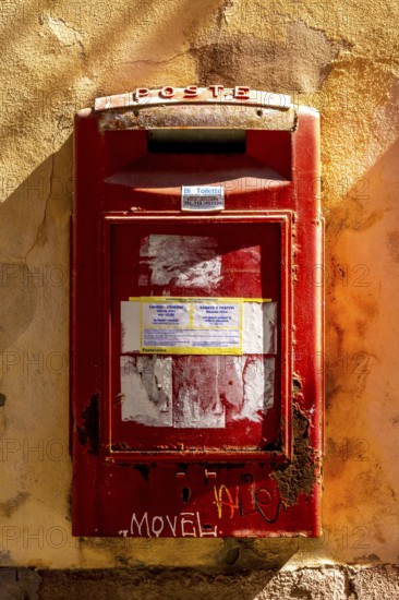 Sardinia, red letterbox on orange house wall, Bosa, Europe, Province of Oristano, Italy,