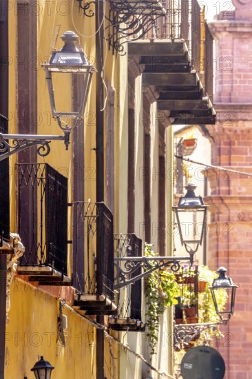 Sardinia, house wall with picturesque alleyway lamps, Bosa, Europe, Province of Oristano, Italy,
