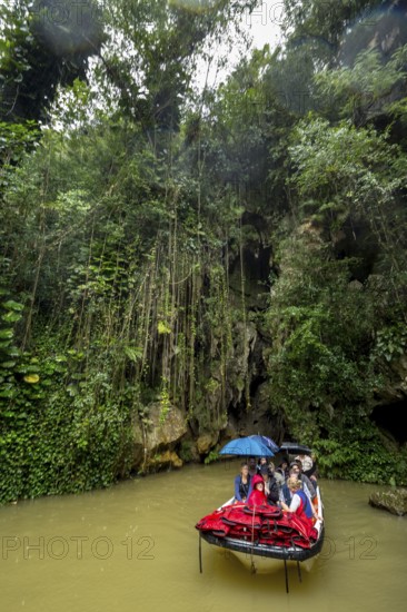 Exit of the cave system, tourists in an electric boat with life jackets, caves of the Indios, Cueva
