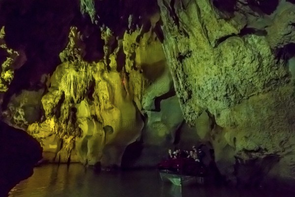 Tourists in a boat on the underground rivers in the caves of the Indios, Cueva del Indio,