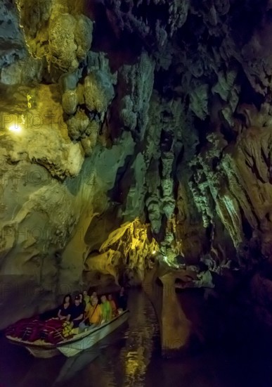 Tourists in a boat on the underground rivers in the caves of the Indios, Cueva del Indio,