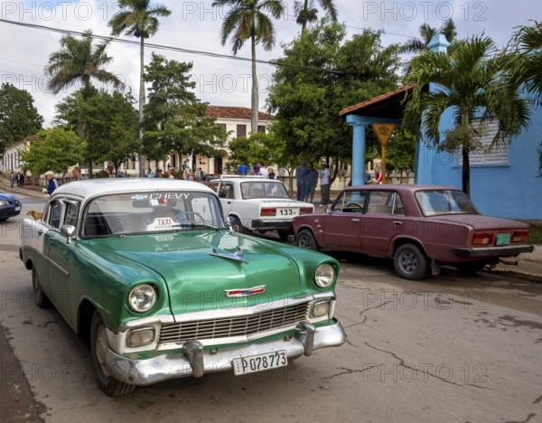Vintage cars, old road cruisers in Vinales in the Vinales Valley, Cuba, Vinales, Central America,