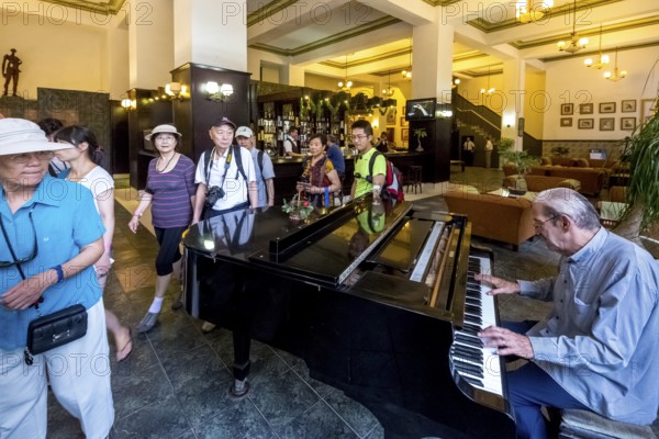 Hotel Amos Mundos, hotel of the writer Ernest Hamingway in Havana, lobby of the hotel with piano