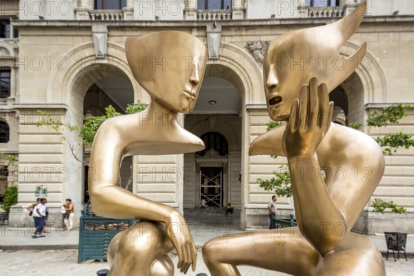 Golden art figures on the Plaza de San Francisco in the old town of Cuba, artist Etienne La