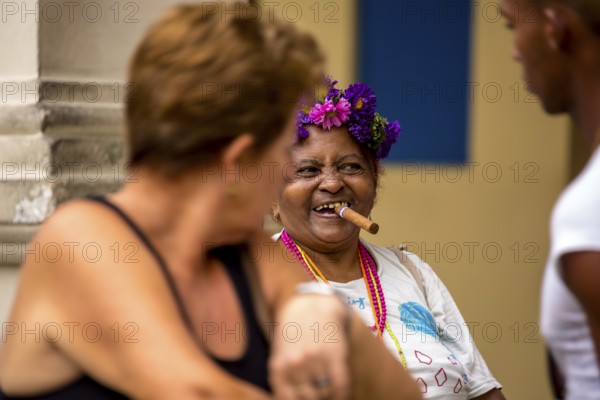 Old Cuban woman with cigar addresses tourists, La Habana, Havana, Cuba, Cuba, Europe, aerial view,