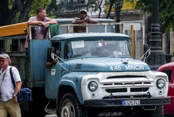Oldtimer in street view, lorry with workers on the loading area, La Habana, Havana, Cuba, Cuba,