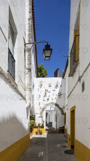 Alley in Evora with lanterns, Evora, Évora district, Portugal