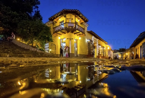 Restaurant and pub in the old town of Trinidad with visitors during the blue hour, Trinidad, Cuba,