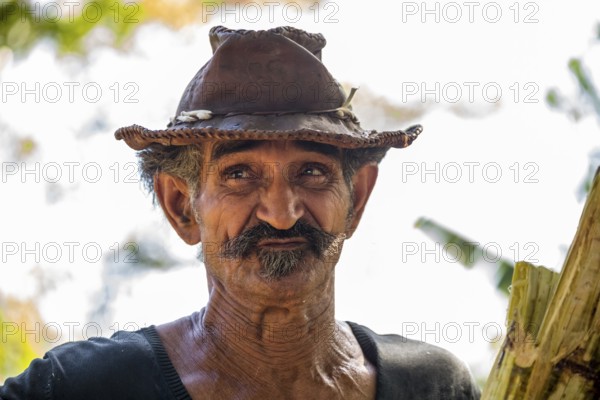 Sugar cane farmer in Valle de los Ingenios, portrait with hat, Trinidad, Cuba, Sancti Spíritus,