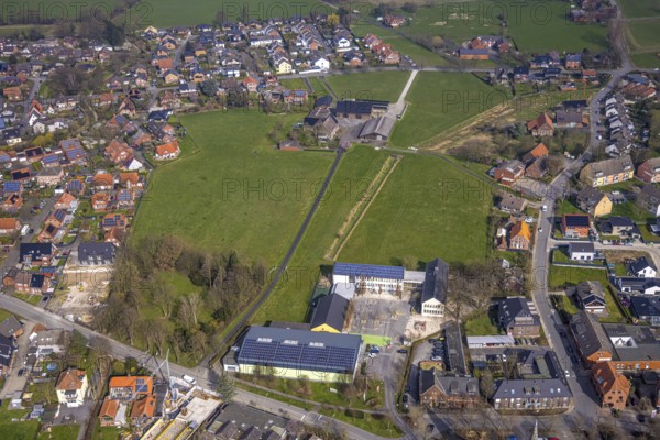 Aerial view, meadow area and planned building area between Hof Northoff and catholic Lambertischule