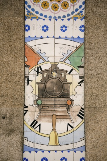 Azulejos tiles depict a steam locomotive with clock, Sao Bento railway station, Oporto, Porto