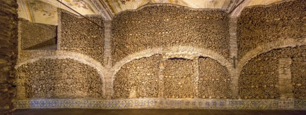 Piled bones in the ossuary, Capela dos ossos parede, chapel of bones, bone chapel, ossuary in