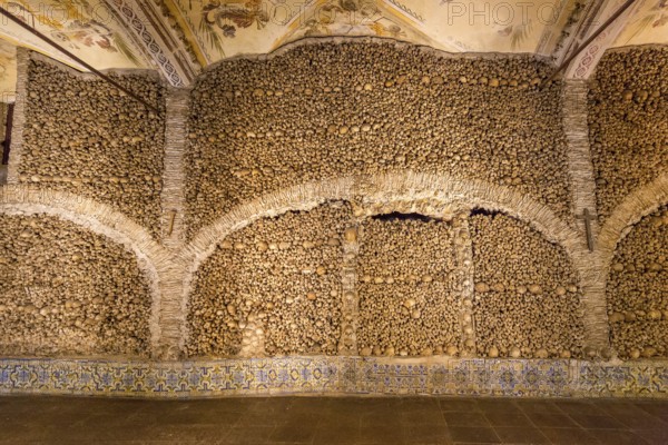 Piled bones in the ossuary, Capela dos ossos parede, chapel of bones, bone chapel, ossuary in