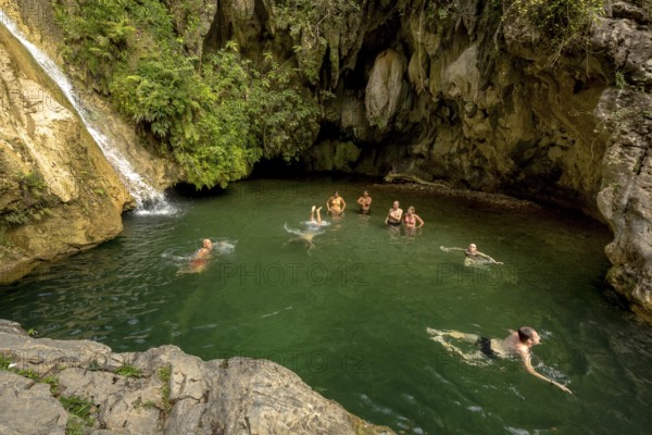 Small bathing lake in the Valle de los Ingenios with tourists, Trinidad, Cuba, Sancti Spíritus,