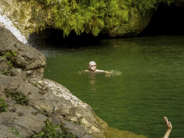 Small bathing lake in the Valle de los Ingenios with tourists, Trinidad, Cuba, Sancti Spíritus,