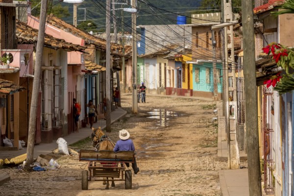 Cuban rider cowboy with his horse in the streets of Trinidad, Trinidad, Cuba, Sancti Spíritus,