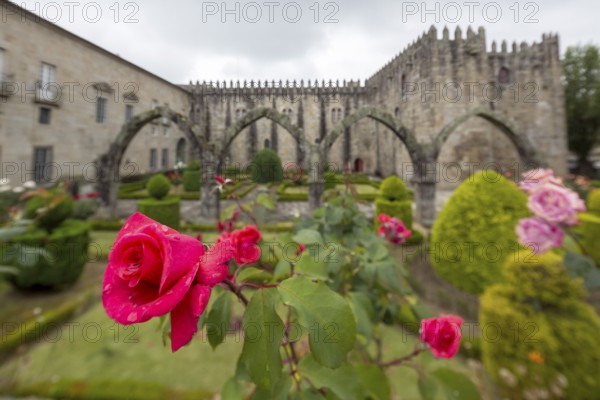 Jardim de Santa Barbara borders the crenellated facade of Antigo Paco Episcopal, former