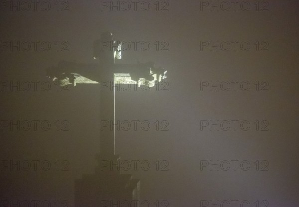 Cross of Bom Jesus do Monte, pilgrimage church of Braga in the evening fog, Braga, district of