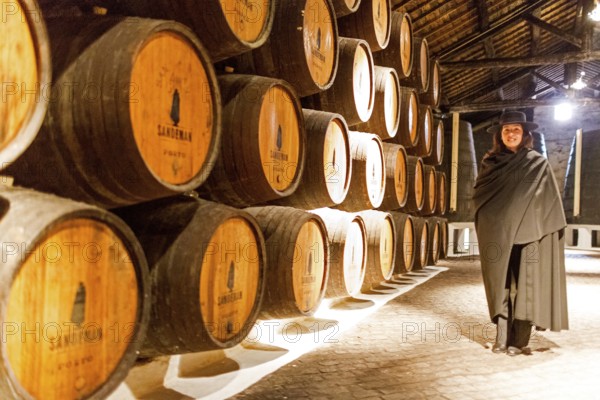 Classic travel guide with student robe, zorro hat and cape, port wine barrels, wine cellar of the