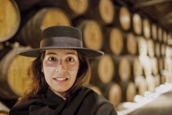 Classic travel guide with student robe, zorro hat and cape, port wine barrels, wine cellar of the