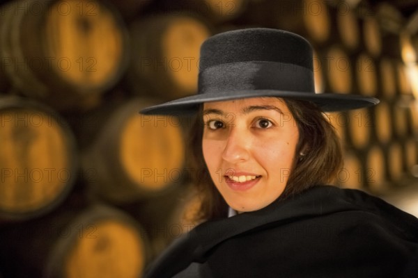 Classic travel guide with student robe, zorro hat and cape, port wine barrels, wine cellar of the