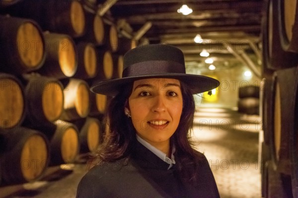 Classic travel guide with student robe, zorro hat and cape, port wine barrels, wine cellar of the