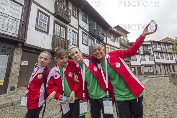 Young sportswomen in the historic centre of Guimaraes, Guimaraes, Braga district, Portugal, Europe,