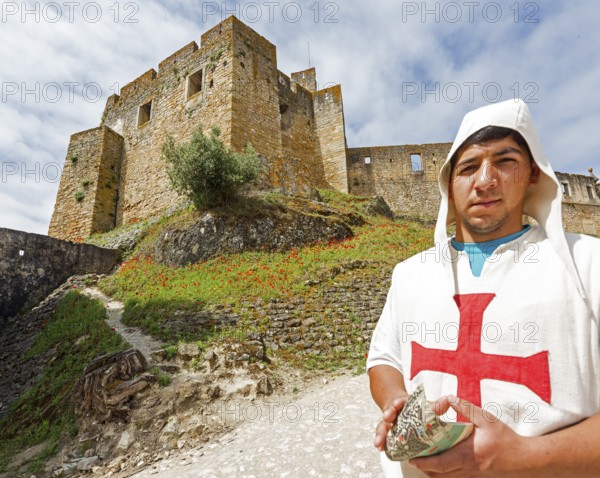 Brochure distributor dressed as Knights Templar in front of the castle, Fortress of Tomar, Castle