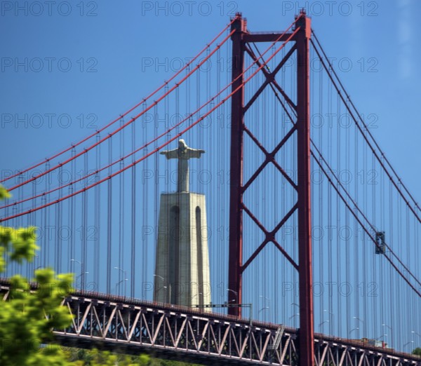 The 113 metre high Cristo-Rei statue of Christ, erected in 1959, photographed through the Puente 25