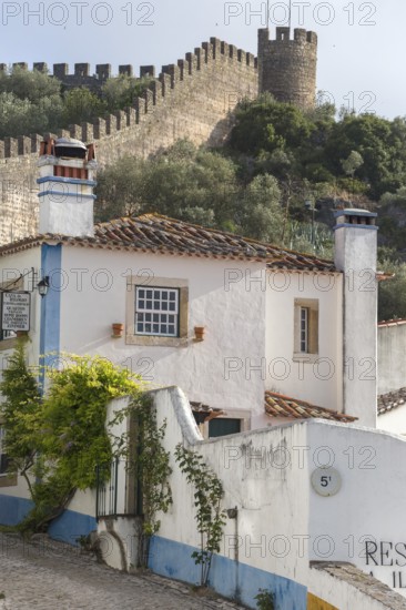 Alley with city wall, picturesque small town Obidos, Ãbidos, district Leiria, Portugal, Europe,