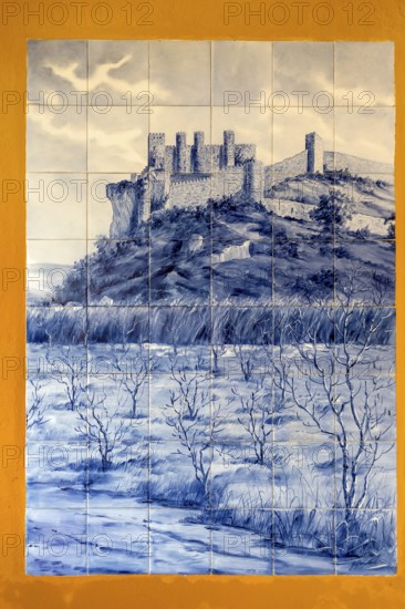 Azelejos, painted tiles with the city motif of the city wall and Obidos Castle, picturesque small