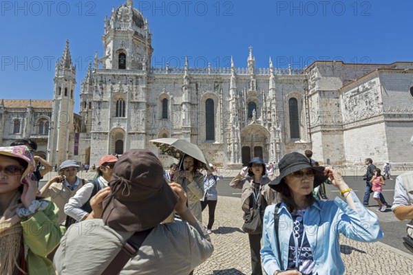 Japanese tourists in front of the Mosteiro dos Jerónimos, UNESCO World Heritage Site, Lisbon,