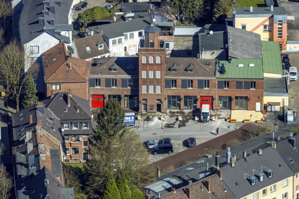 Aerial view, old fire station with tower on the main street, planned redesign for residential area,