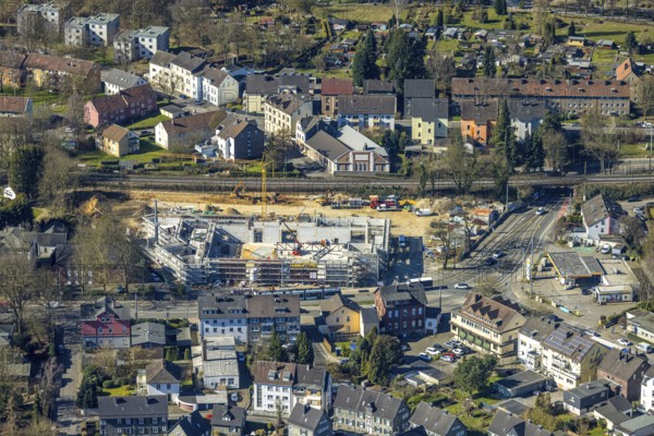 Aerial view, construction site with new building shopping centre Rewe supermarket,