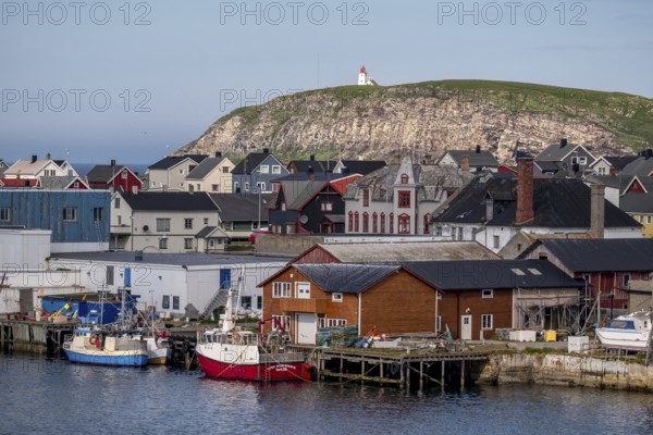 Fishing boats in the harbour, Vardø fyr on the island of Hornøya, lighthouse, Vardø, Finnmark,