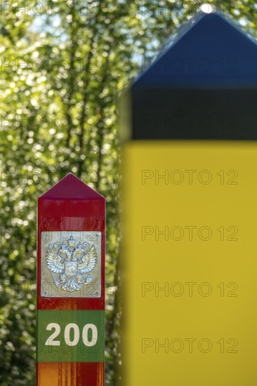 Border Norway-Russia, border posts, yellow border post Norway, red-green border post Russia,